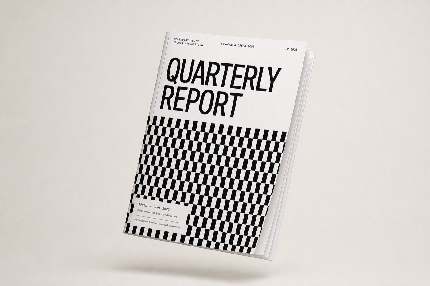 The printed quarterly report as a saddle-stitched booklet with pages fanned, photographed on a warm paper ground